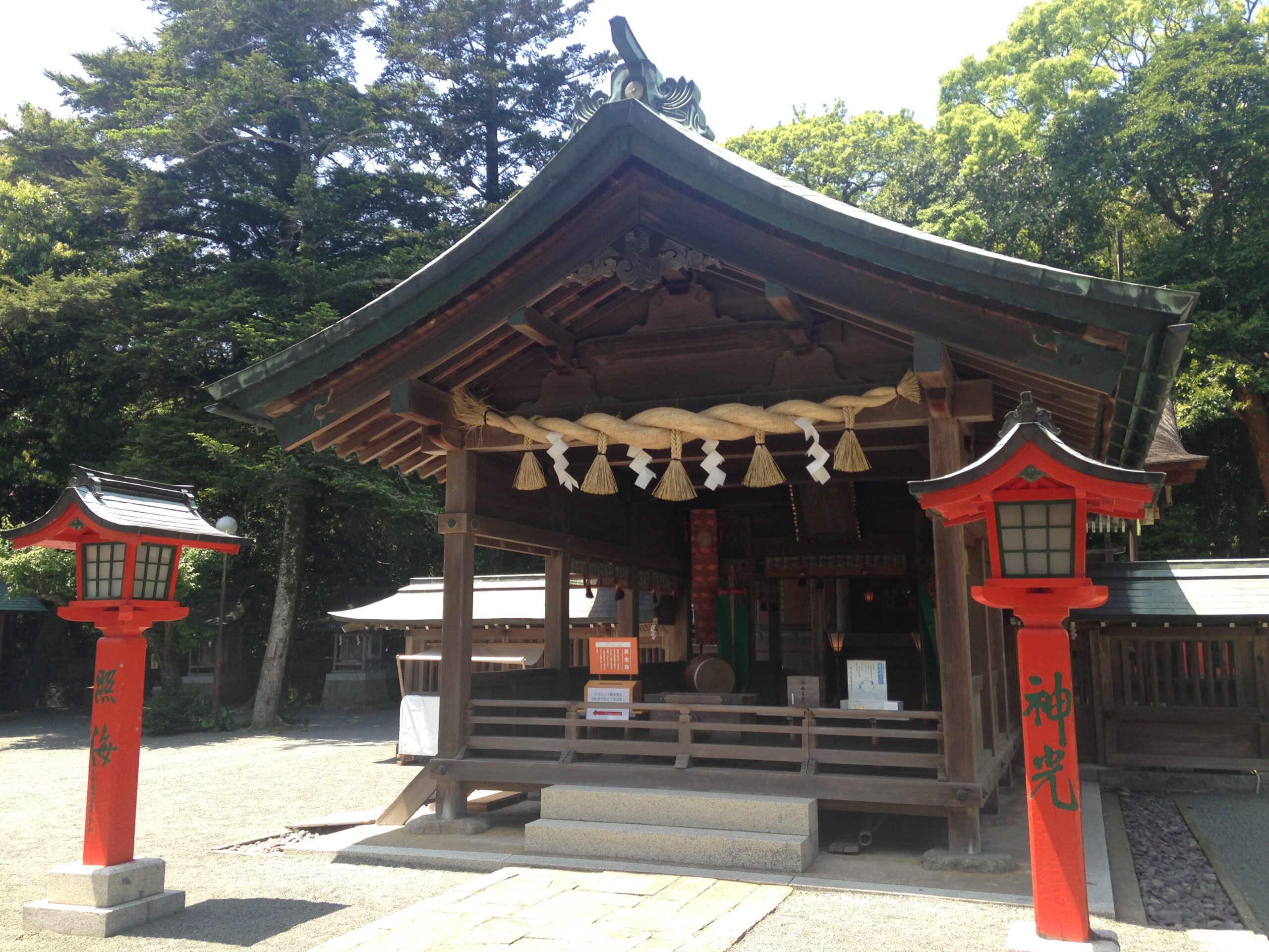 The worship hall (haiden) of Nakatsu-gu on Oshima Island, with sacred rope and red lanterns