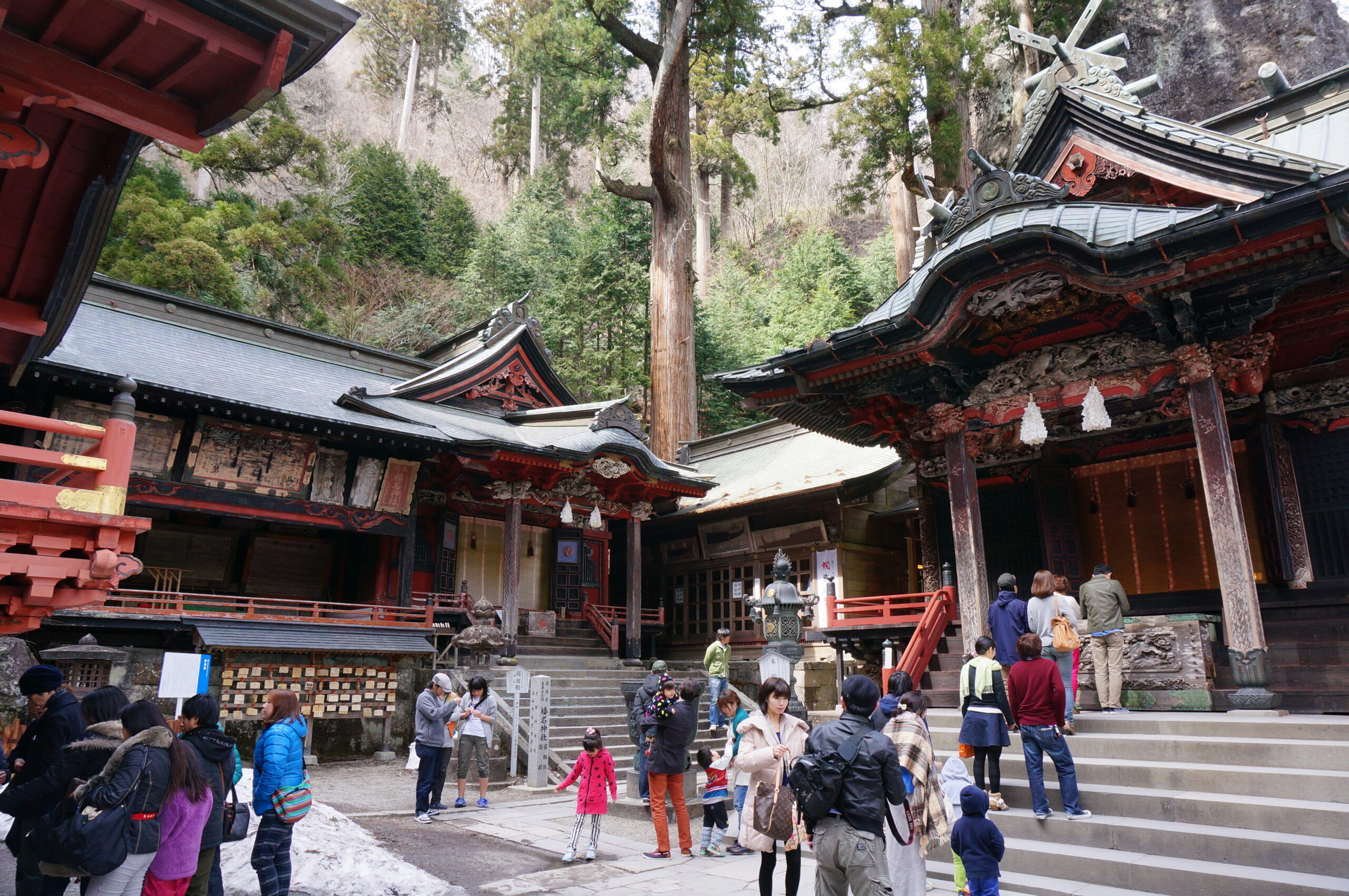 The main hall area of Haruna Shrine with the massive Misugata-iwa boulder behind it